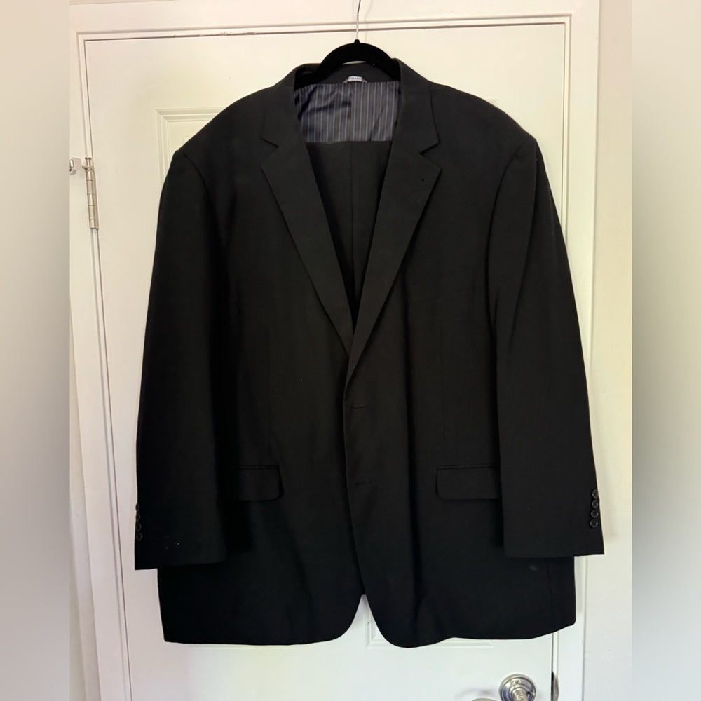 Men’s CM gold series black suit. Jacket size 54R, pants 50/30 with cuffs.